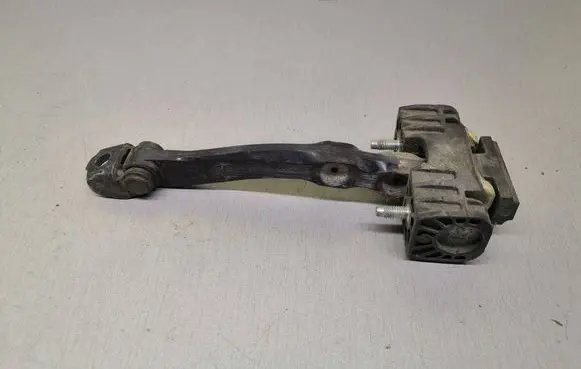 Front door check strap stopper