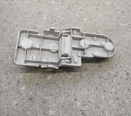 Tail light bulb cover holder