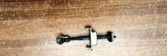 Subaru Legacy Rear door check strap stopper