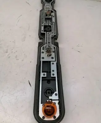 Tail light bulb cover holder