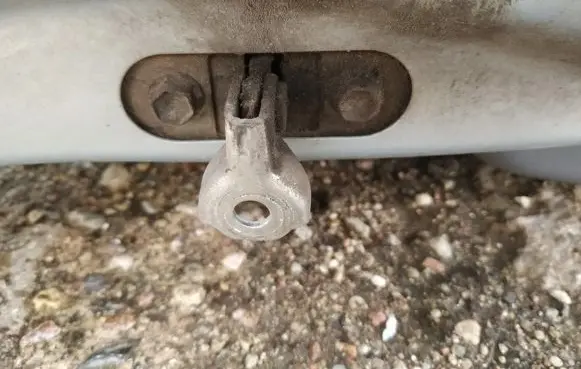 Front door check strap stopper