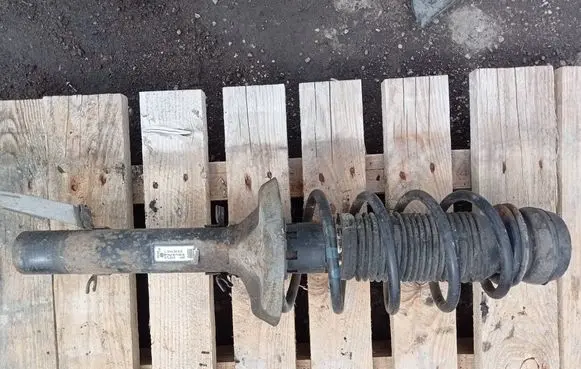 Volkswagen Golf IV Front shock absorber with coil spring 1J0413034S