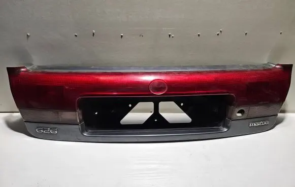 Mazda 626 Trunk door license plate light bar 0431394