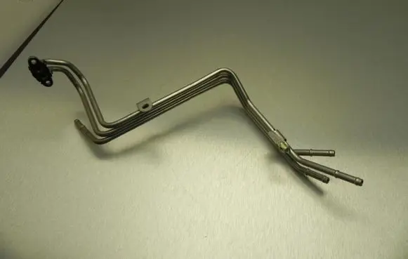 Volkswagen Golf VII Engine coolant pipe/hose 04E122157H VD9341
