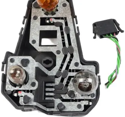 Tail light bulb cover holder