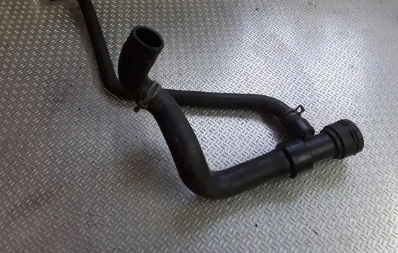 Volkswagen PASSAT B5 Engine coolant pipe/hose 8D0121055F