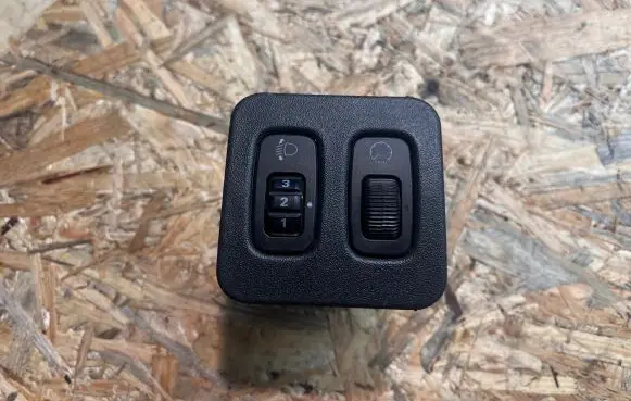 Mitsubishi Lancer Headlight level height control switch