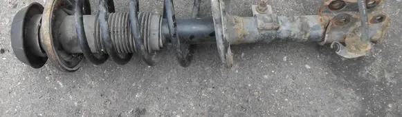 Suzuki Swift I Front shock absorber with coil spring 4160162J32
