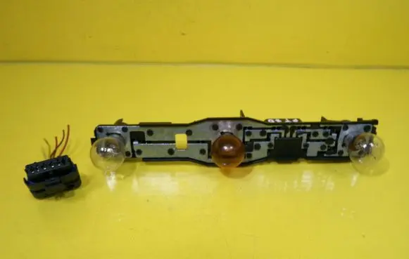 Nissan Micra Tail light bulb cover holder 