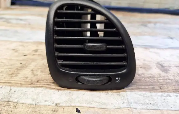 Dash center air vent grill