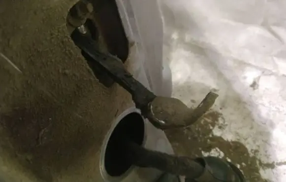 Front door check strap stopper