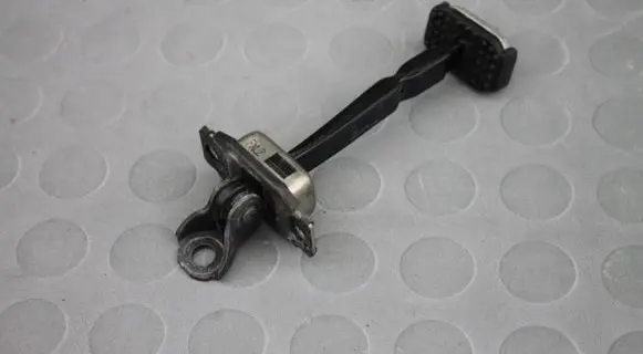 Rear door check strap stopper