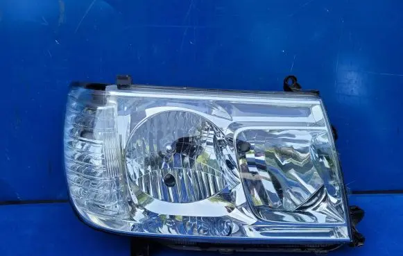 Toyota Land Cruiser (J100) Headlight/headlamp 60112