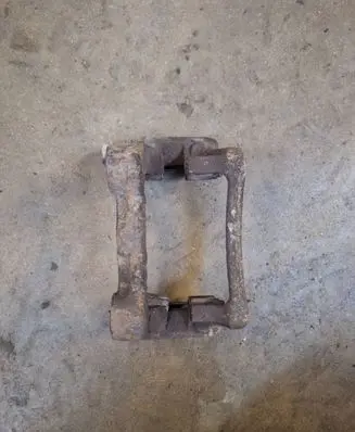 Volkswagen Touran I Brake caliper pad carrier rear 