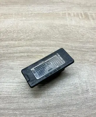 Volkswagen Touareg I Number plate light 5N0943021 1K9943021A