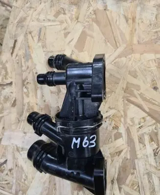 Thermostat/thermostat housing