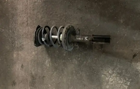 Renault Megane III Front shock absorber with coil spring