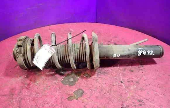 Front shock absorber with coil spring