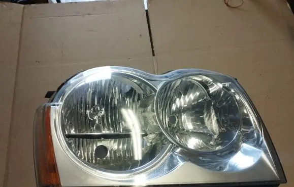 Jeep Grand Cherokee (WK) Headlight/headlamp 55156350AG