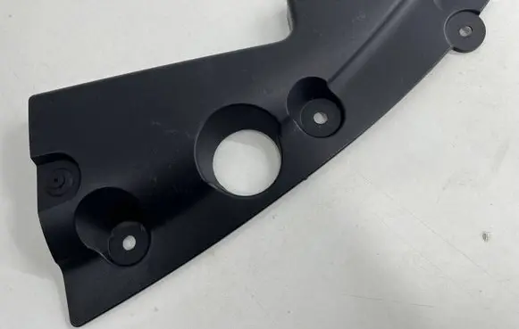 Engine bonnet/hood lock trim molding