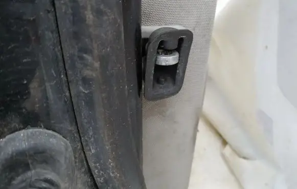 Rear door check strap stopper