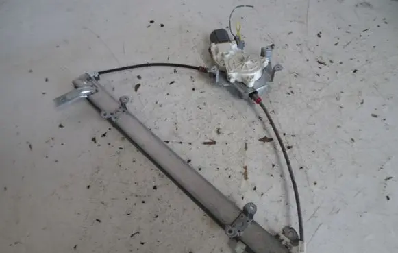 Nissan Micra Front door window regulator with motor 