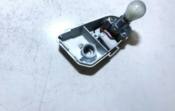 Mazda 626 Tail light bulb cover holder