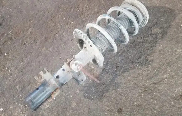 Front shock absorber with coil spring