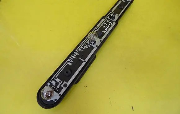 Tail light bulb cover holder