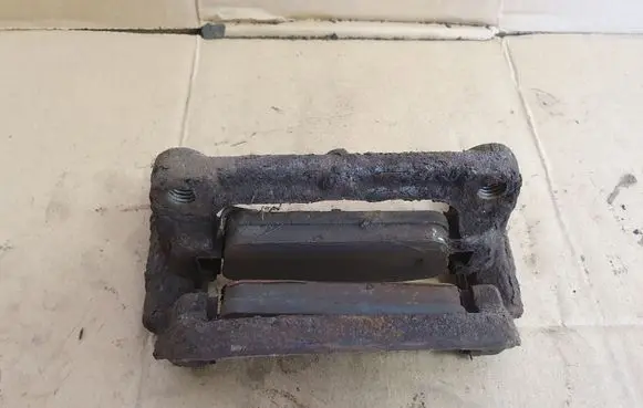 Opel Astra J Brake caliper pad carrier rear 
