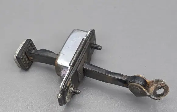 Front door check strap stopper