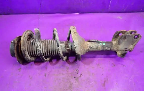 Subaru Outback Front shock absorber with coil spring 