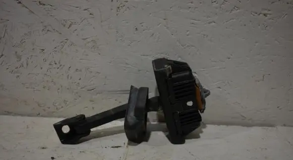 Front door check strap stopper