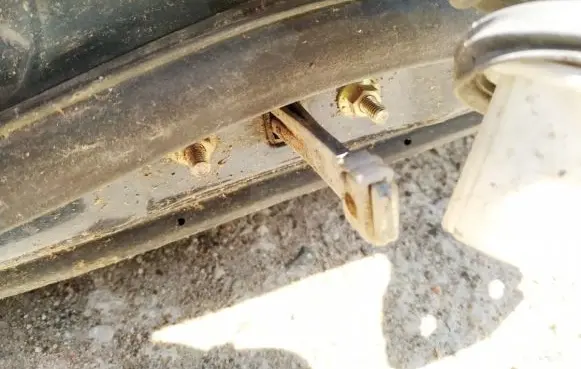 Mazda 323 F Rear door check strap stopper