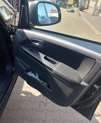Suzuki SX4 Front door card panel trim