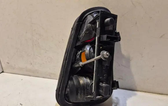 Tail light bulb cover holder