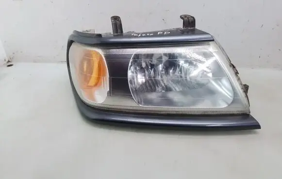 Mitsubishi Pajero Sport I Headlight/headlamp 10087415