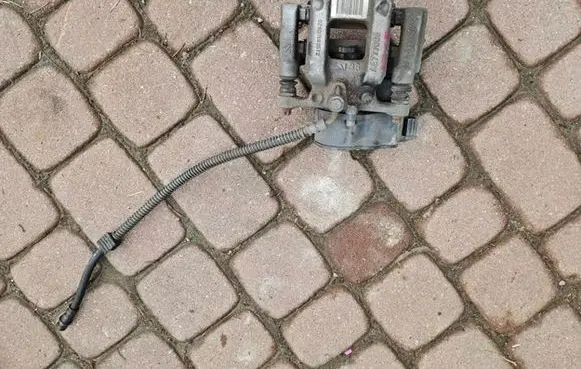 Opel Corsa F Rear brake caliper 9819059380