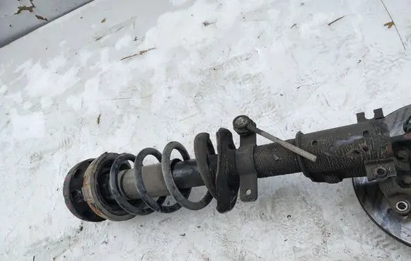 Front shock absorber with coil spring
