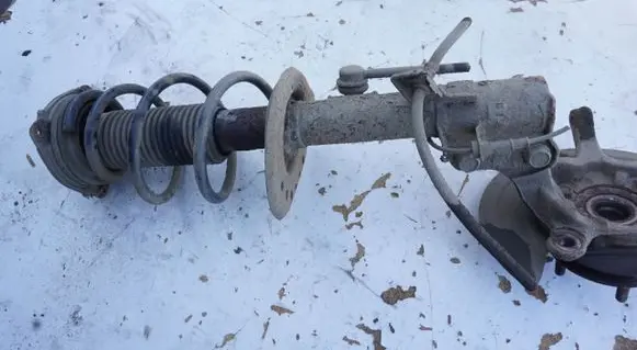 Nissan Juke I F15 Front shock absorber with coil spring