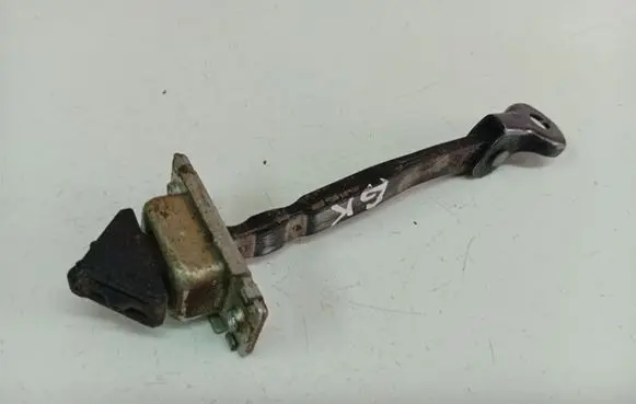 Mazda 3 II Rear door check strap stopper