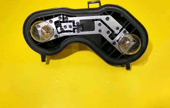 Tail light bulb cover holder