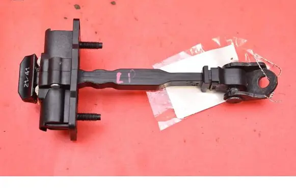 Front door check strap stopper