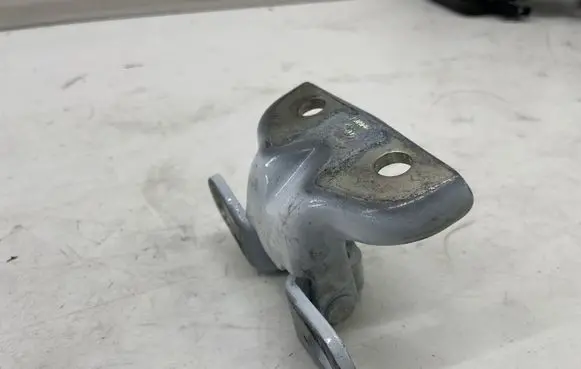 Rear door upper hinge