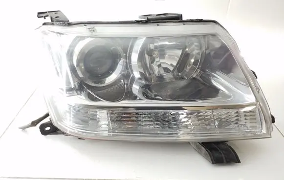 Suzuki Grand Vitara II Headlight/headlamp 10059079