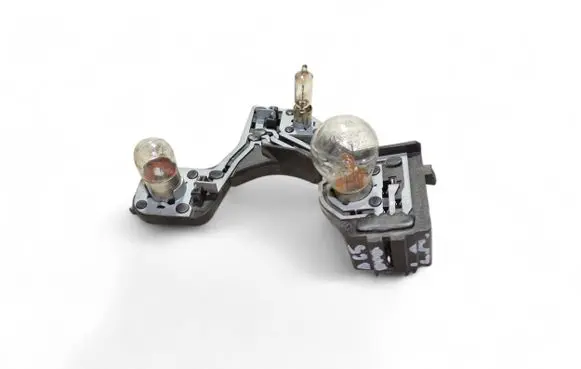 Tail light bulb cover holder