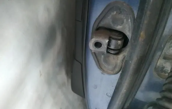 Rear door check strap stopper