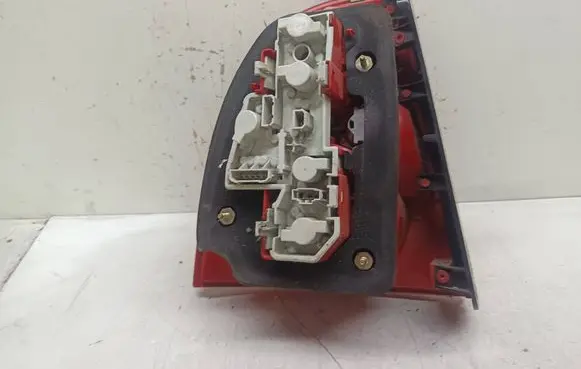 Tail light bulb cover holder