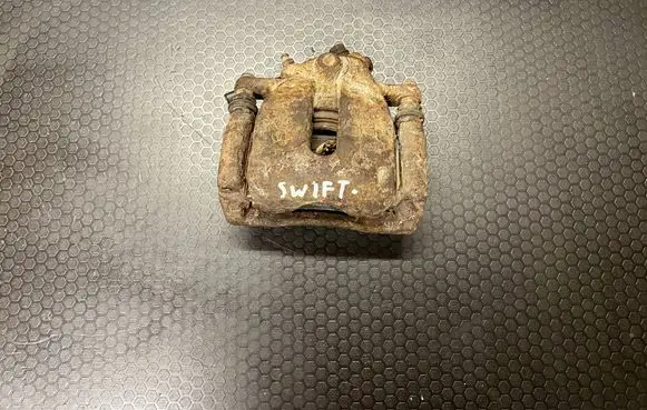 Suzuki Swift I Front brake caliper