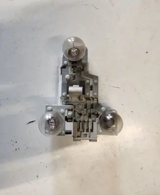 Tail light bulb cover holder